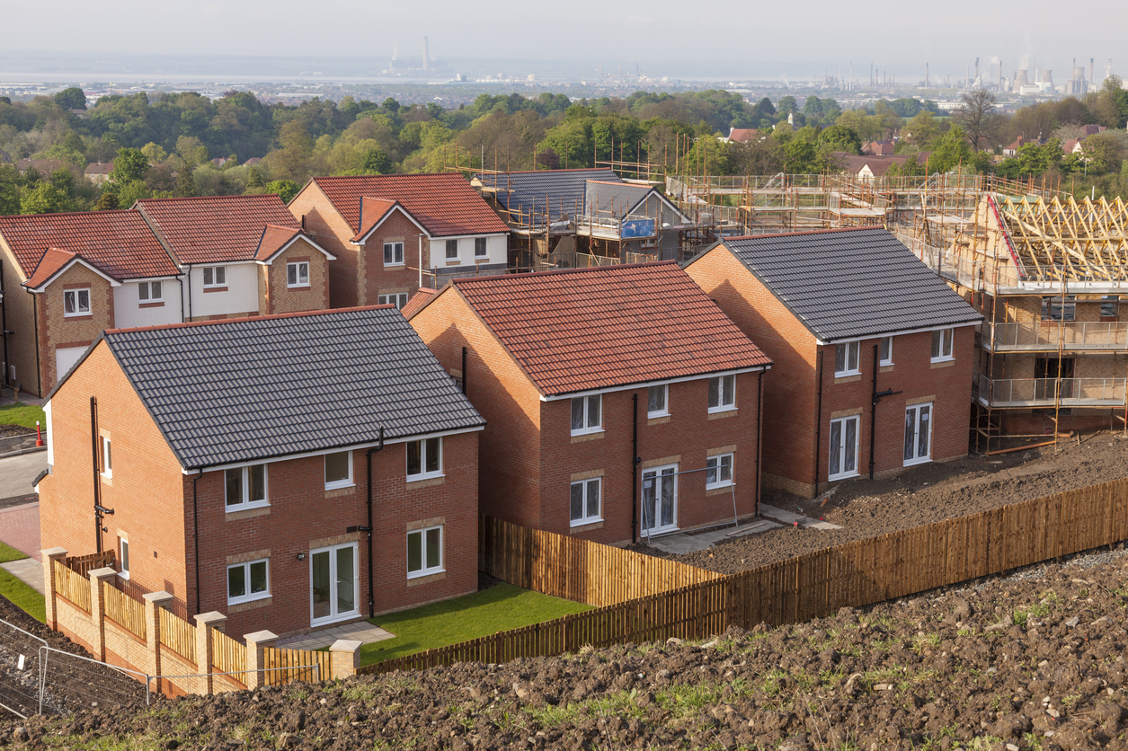 A row of detached newly built houses on a development in Central Scotland.